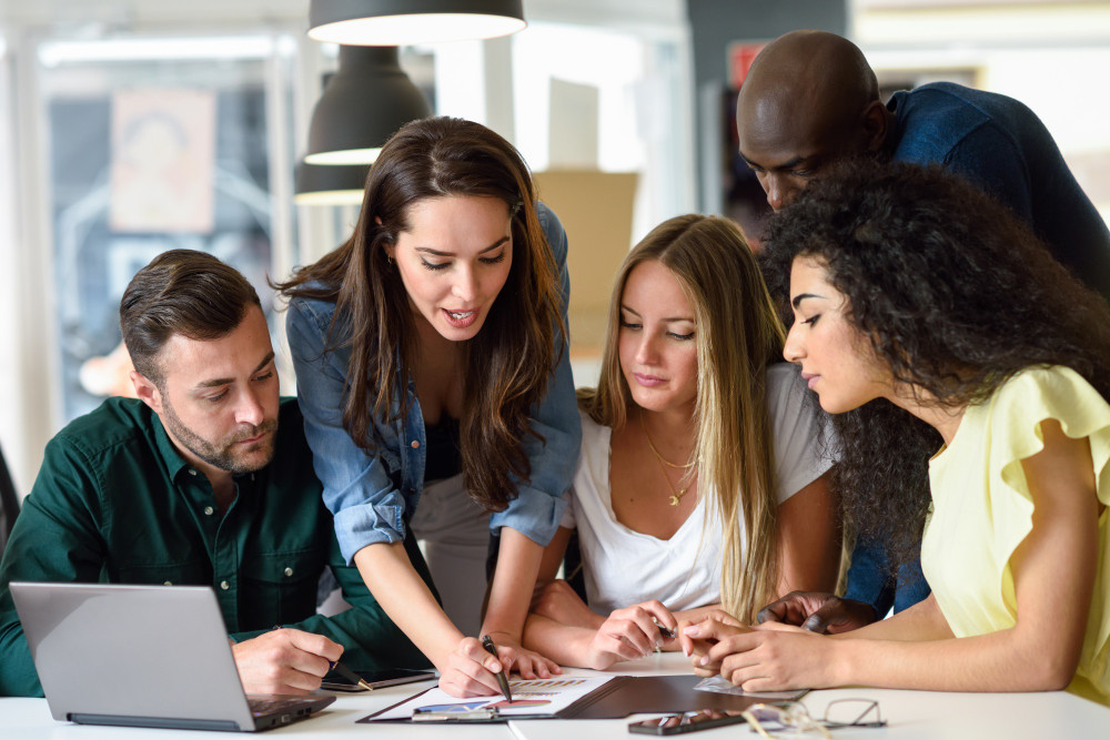 multi-ethnic-group-of-young-men-and-women-studying-indoors